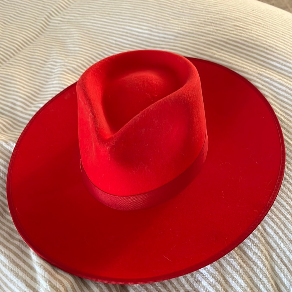 Lack of color bright red hat size small